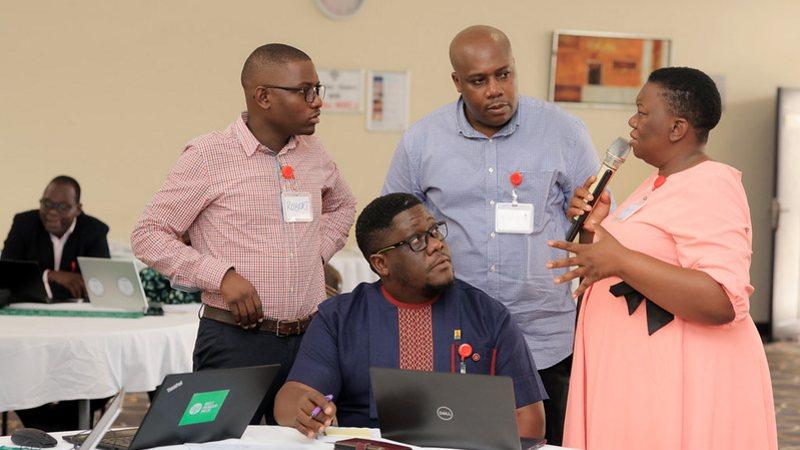 Participants discussing at the National WASH Building Blocks Reflection in Uganda