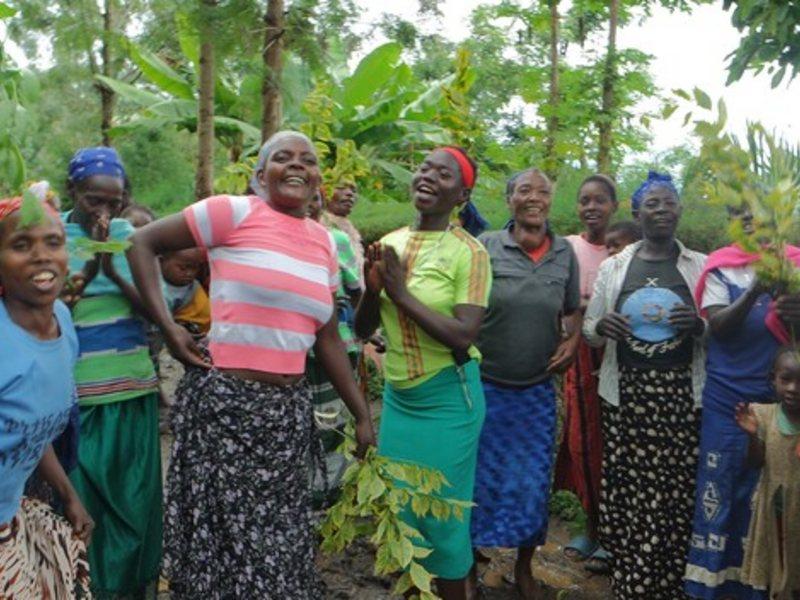 Women celebrating water infrastructure constructed in their neighbout