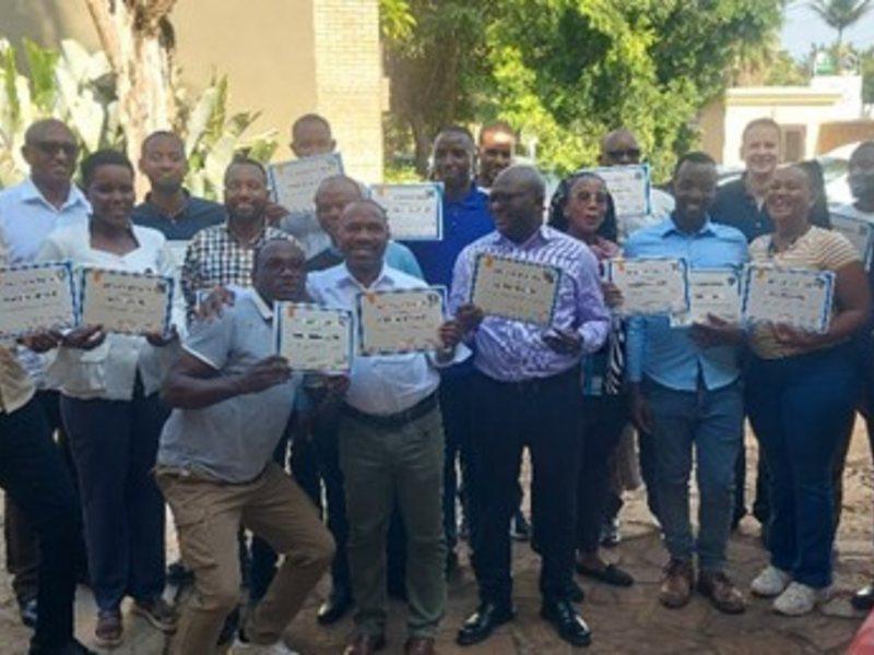 Workshop participants showing their certficate
