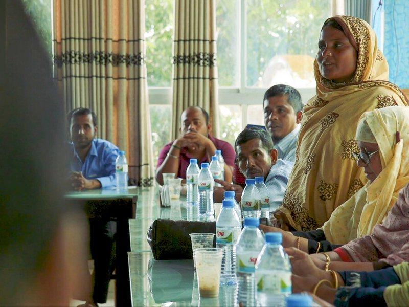 Kohinoor Begum, who submitted a successful petition to the local government to install a borehole in her community, participates in district budget allocations for the sector in Bhola, Bangladesh