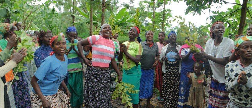 Women celebrating water infrastructure constructed in their neighbout
