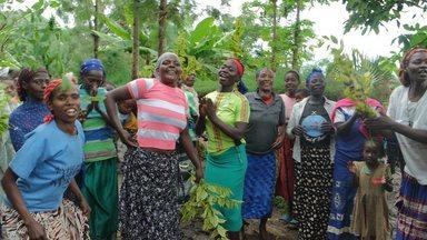 Women celebrating water infrastructure constructed in their neighbout