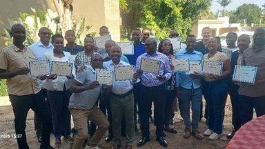 Workshop participants showing their certficate