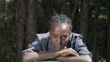 Metike, you woman in Ethiopia leaning on a rope pump