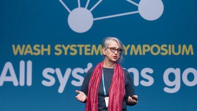 Barbara Schreiner CEO of the Water Integrity Network on stage of the All Systems Go symposium 2019