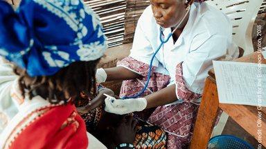 Female nurse attending a patien