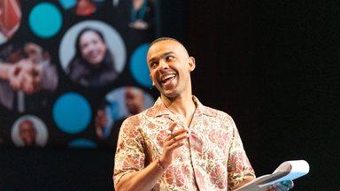 Ikenna Azuike MC on stage of the All systems connect symposium 2023