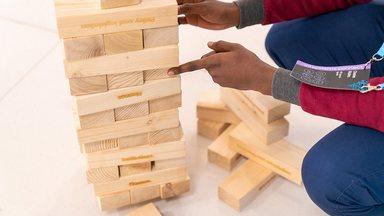 Young man playing Jenga