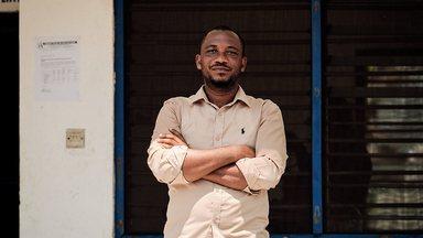 Man folding arms at the Community Water and Sanitation Agency Esiama water system
