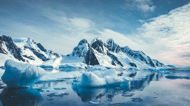 Blue Ice covered mountains in south polar ocean