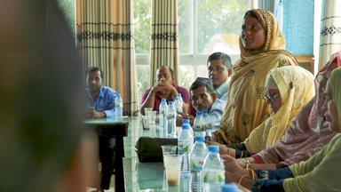 Woman in Bangladesh speaking in a meeting