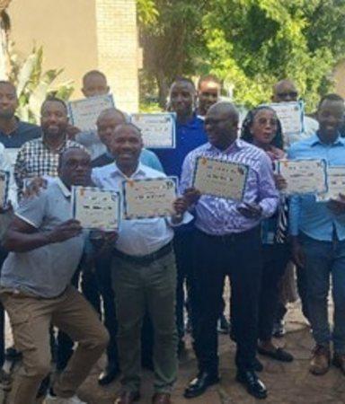 Workshop participants showing their certficate