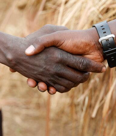 Shaking hands in Uganda