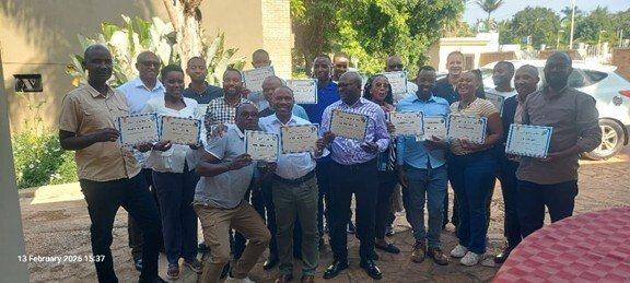 Workshop participants showing their certficate