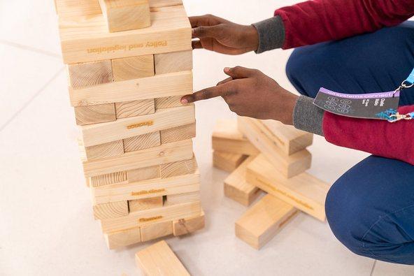 Young man playing Jenga