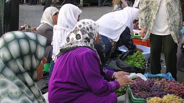 Women selling vegetables and fruit on a market in the Middle East