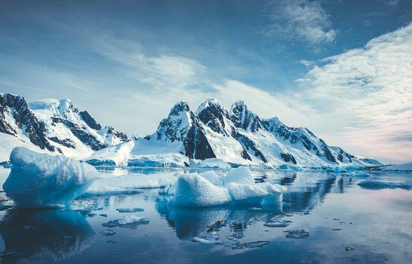 Blue Ice covered mountains in south polar ocean