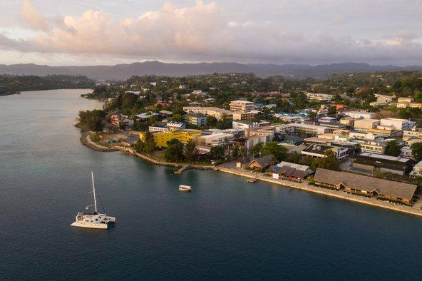 Port Villa waterfront and business district with catamaran in Vanuatu capital city in the south Pacifi