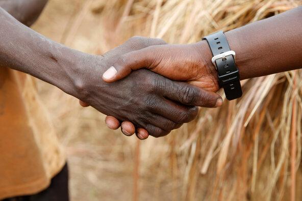 Shaking hands in Uganda