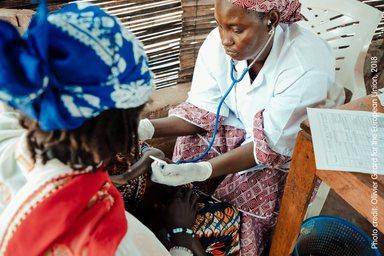 Female nurse attending a patien