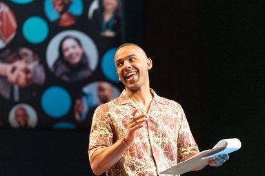 Ikenna Azuike MC on stage of the All systems connect symposium 2023