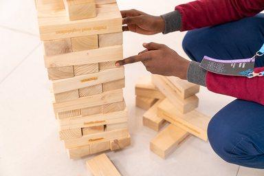 Young man playing Jenga