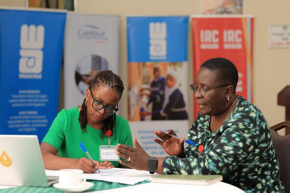Jane Nabunnya reflecting in a workshop setting during the National WASH building blocks reflection session in 2026